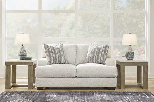 This loveseat speaks to those drawn to fresh, contemporary style with richly neutral appeal. Wrapped in a wonderfully plush fabric loaded with multi-tonal interest, this on-trend piece has a warm, welcoming charm. Coordinating accent pillows add to the indulgence. Kick back, relax and settle in for comfort with this cool addition for modern spaces.